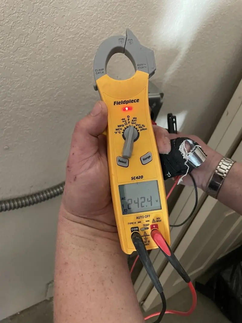 Voltage testing with clamp meter during Electrical Installation Services in Snyder